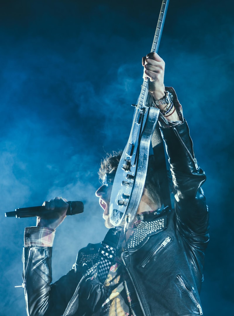 Journey tribute, rock guitarist under blue stage lights